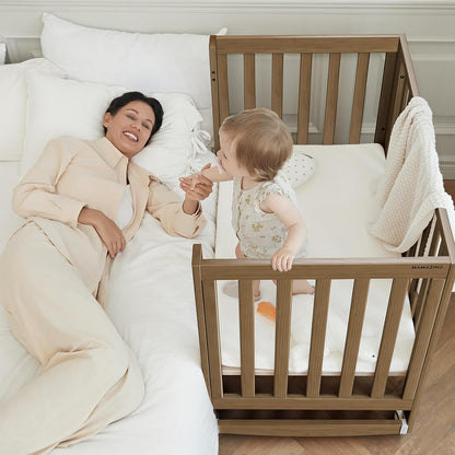 EvoNest Baby Crib, 6 in 1 Convertible Mini Crib with Wheels, 100% New Zealand Wood Growing Bed, 4 Adjustable Mattress Height，Walnut Brown