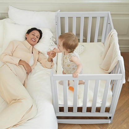 EvoNest Baby Crib, 6 in 1 Convertible Mini Crib with Wheels, 100% New Zealand Pinewood Growing Bed, 4 Adjustable Mattress Height， (Milk)