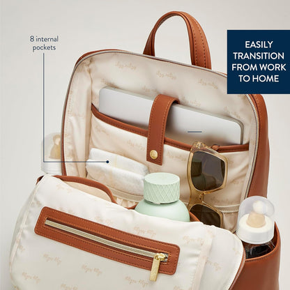 Itzy Ritzy Eras Diaper Bag Backpack – Large Capacity Backpack Diaper Bag Featuring Sleek Design, 15 Pockets, Changing Pad, Stroller Straps, and Luggage Sleeve (Cognac)